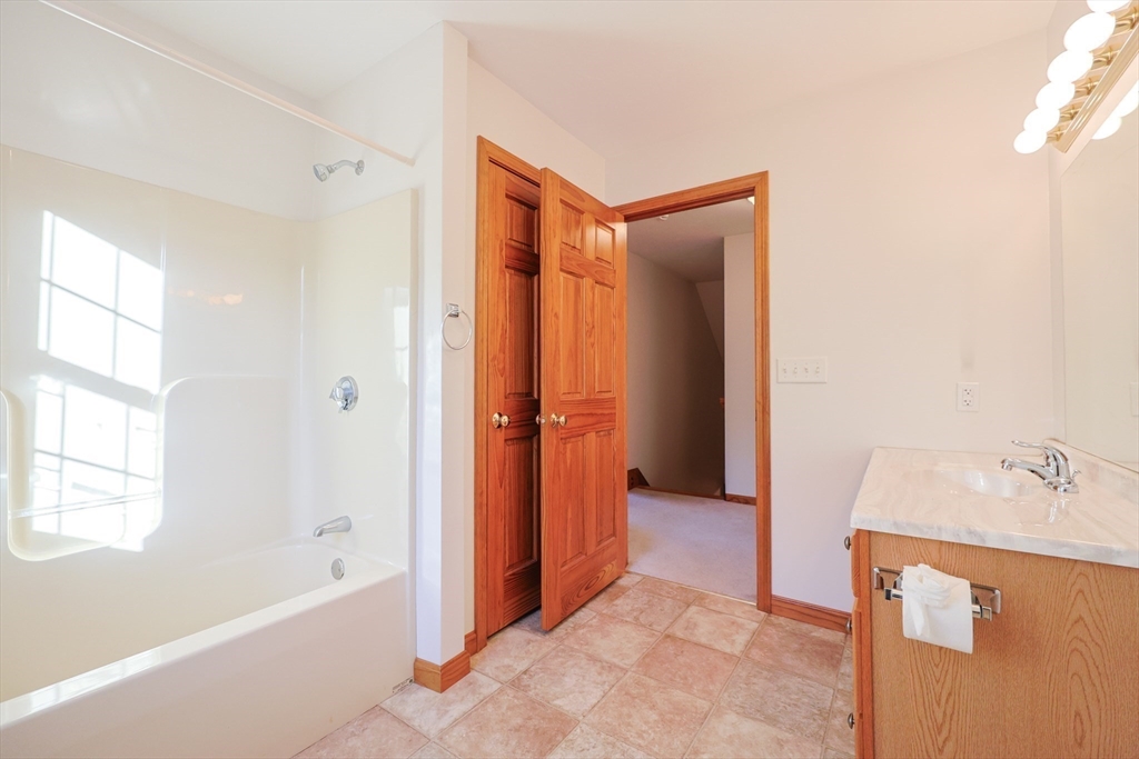 1380 North Brookfield Road Oakham, MA 01068 - Photo 25 of 37 a bathroom with a bathtub and a sink