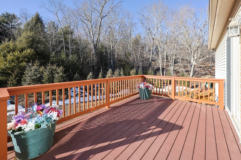 1380 North Brookfield Road Oakham, MA 01068 - Photo 32 of 37 a view of a balcony with wooden floor