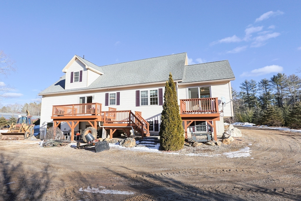 1380 North Brookfield Road Oakham, MA 01068 - Photo 34 of 37 a front view of a residential apartment building with a yard