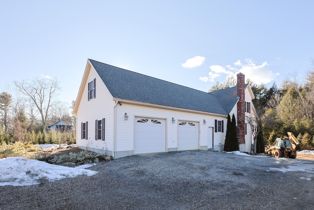 1380 North Brookfield Road Oakham, MA 01068 - Photo 4 of 37 a view of a house with a snow in the yard