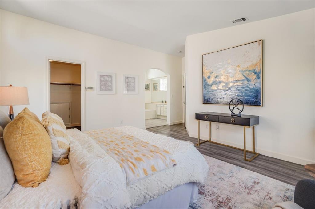 34372 Eucalyptus Terrace Fremont, CA 94555 - Photo 26 of 40 a bedroom with a bed and a painting on the wall