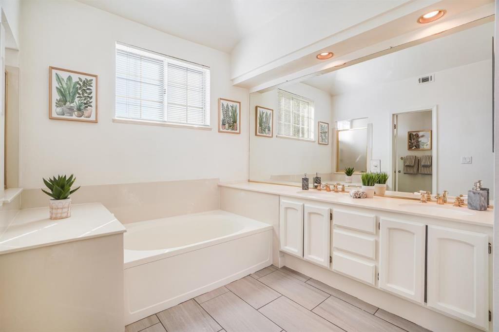 34372 Eucalyptus Terrace Fremont, CA 94555 - Photo 27 of 40 a bathroom with a tub a sink and mirror