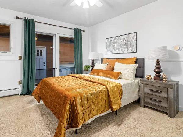 a bedroom with a bed and a cabinets