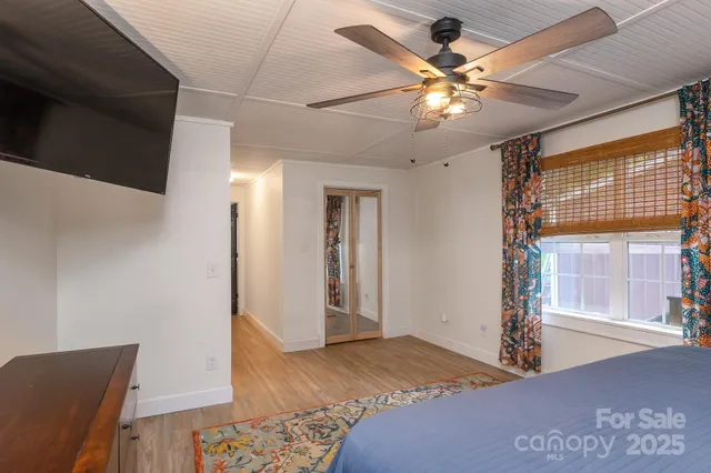 a bedroom with furniture and a window