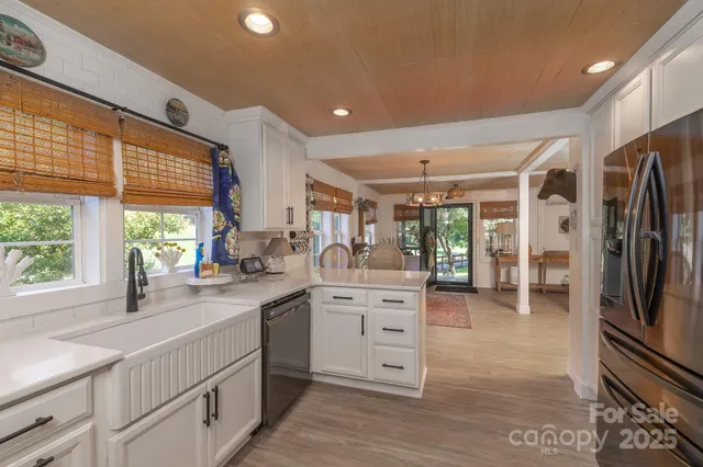 a kitchen with stainless steel appliances a refrigerator stove and microwave