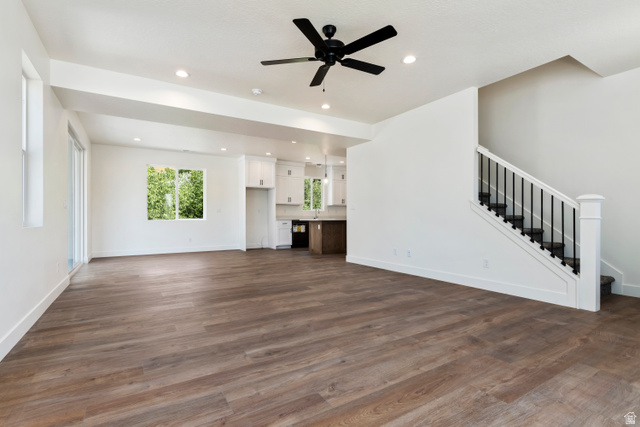 504 North 650 E Street Springville, UT 84663 - Photo 9 of 36 Open-concept living area featuring wood-finish flooring and a contemporary black ceiling fan