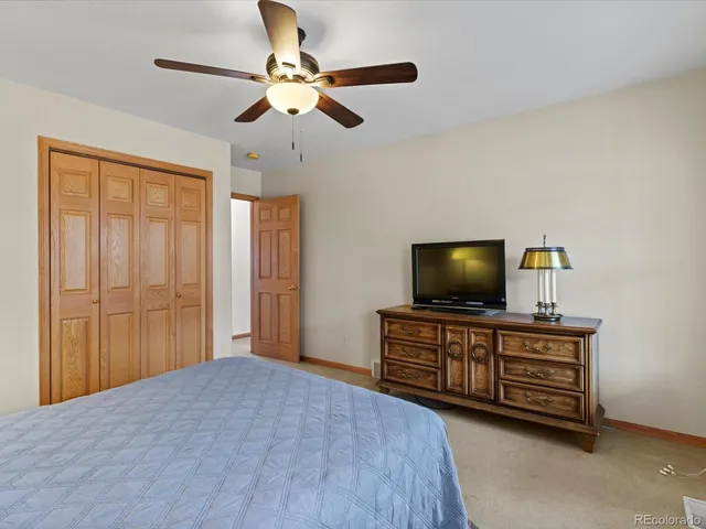 a view of a livingroom with furniture and a window