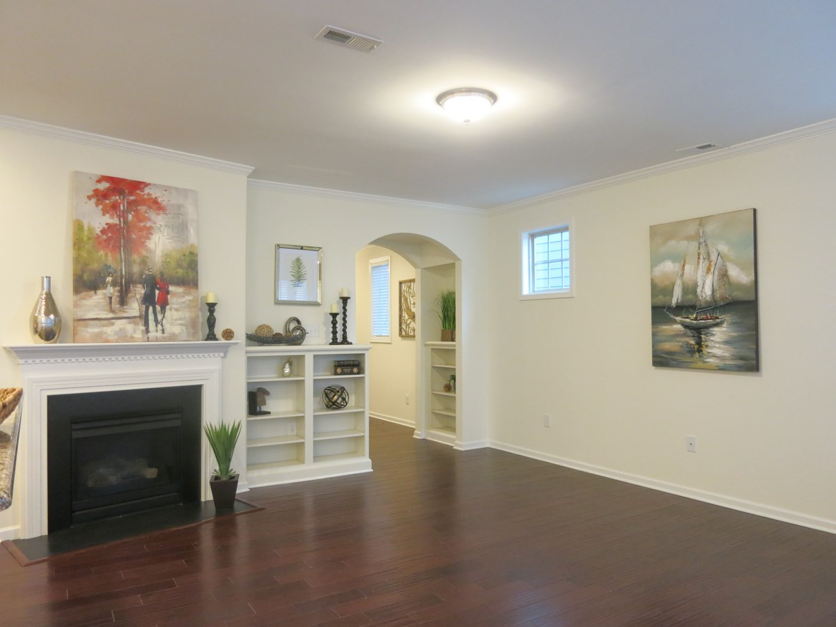 1556 Rodessa Run Raleigh, NC 27607 - Photo 3 of 25 The spacious Living Rm offers a gas log FP, built-in bookcase & lots of windows. Living Room