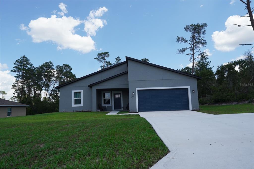 2914 Southwest 162nd Street Road Ocala, FL 34473 - Photo 2 of 47 a front view of house with yard and green space