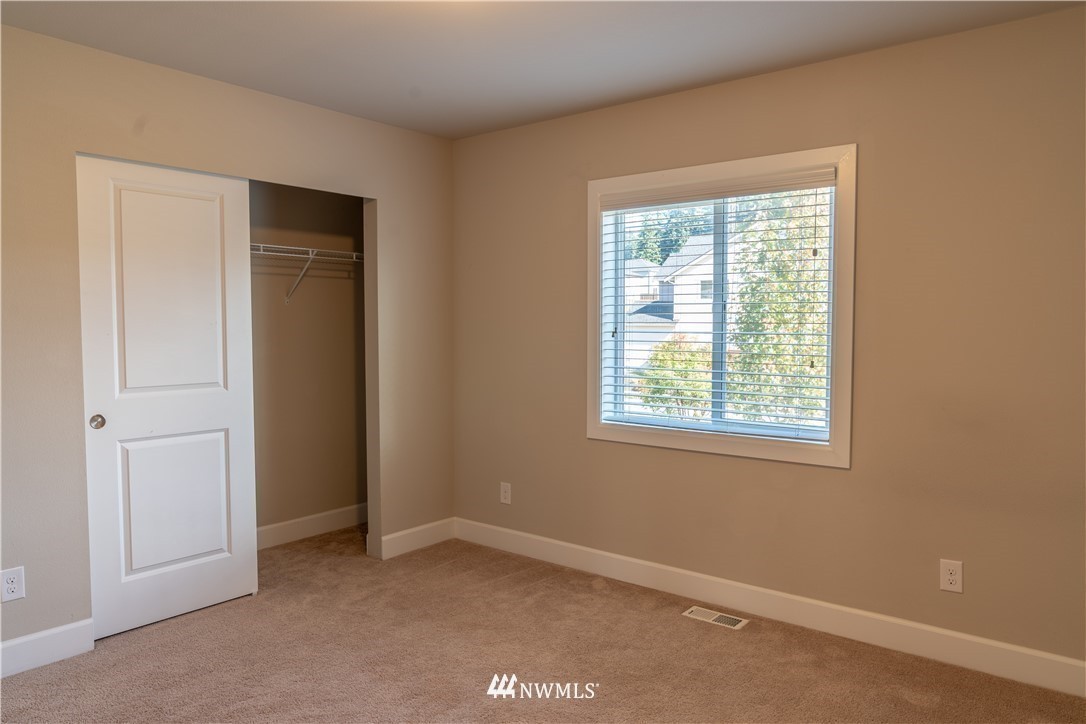 17317 40th Avenue Southeast Bothell, WA 98012 - Photo 18 of 24 an empty room with windows and closet