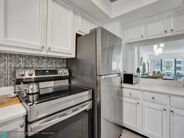 a kitchen with appliances and cabinets