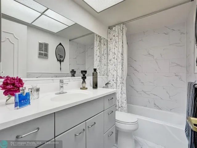 a bathroom with a sink a toilet and a bathtub