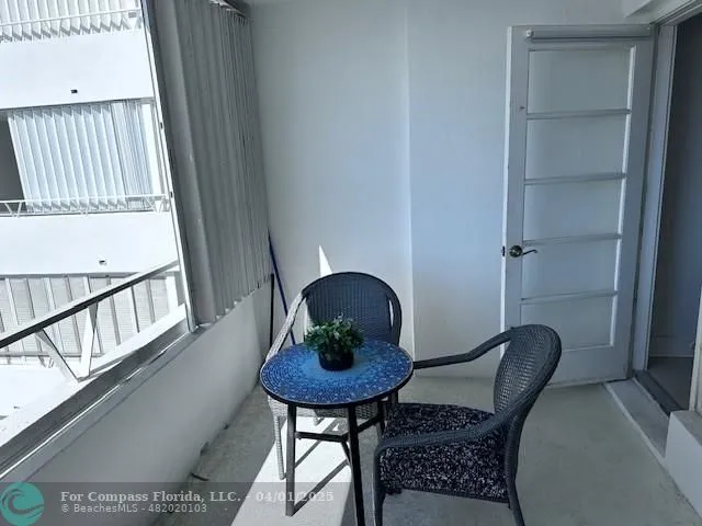 a view of a chair in a balcony