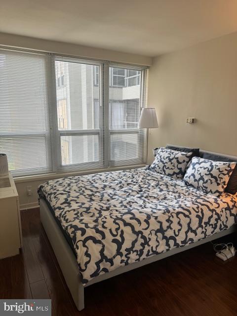 224 West Rittenhouse Square, Unit 1417 Philadelphia, PA 19103 - Photo 11 of 14 a bed sitting in a bedroom next to a window