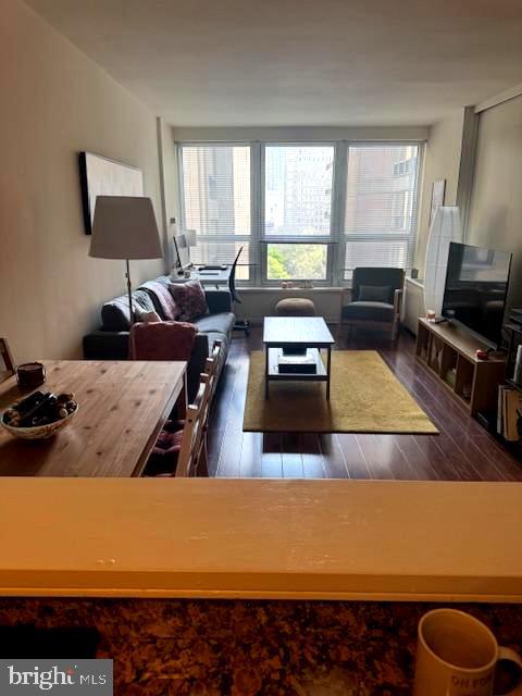 224 West Rittenhouse Square, Unit 1417 Philadelphia, PA 19103 - Photo 4 of 14 a living room with furniture and a flat screen tv
