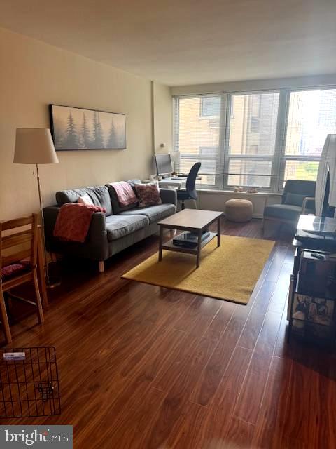 224 West Rittenhouse Square, Unit 1417 Philadelphia, PA 19103 - Photo 5 of 14 a living room with furniture and a large window