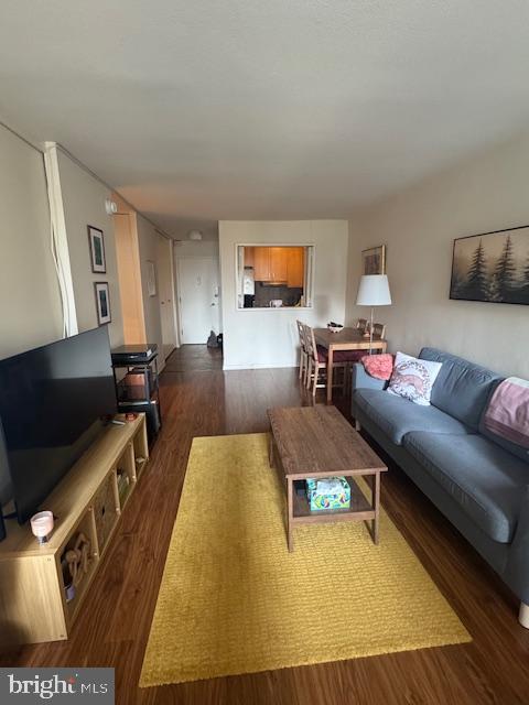 224 West Rittenhouse Square, Unit 1417 Philadelphia, PA 19103 - Photo 10 of 14 a living room with furniture and a flat screen tv