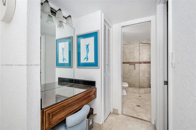 a bathroom with a sink a mirror and a shower