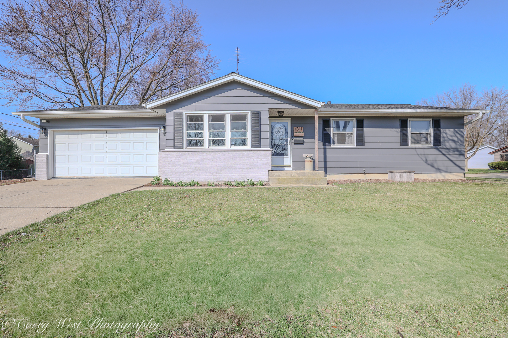 1811 South 7th Street DeKalb, IL 60115 - Photo 1 of 36 a front view of a house with a yard