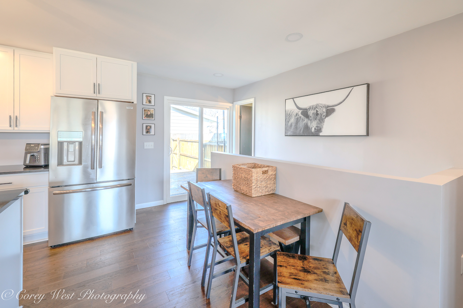 1811 South 7th Street DeKalb, IL 60115 - Photo 13 of 36 a kitchen with stainless steel appliances refrigerator dining table and chairs