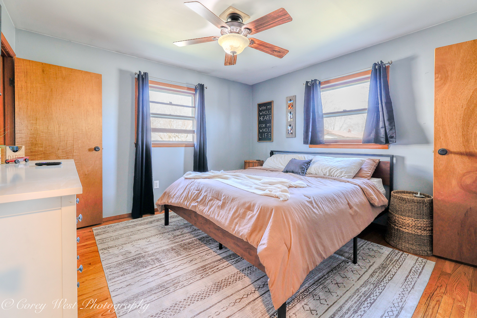 1811 South 7th Street DeKalb, IL 60115 - Photo 16 of 36 a bedroom with a bed and a chandelier