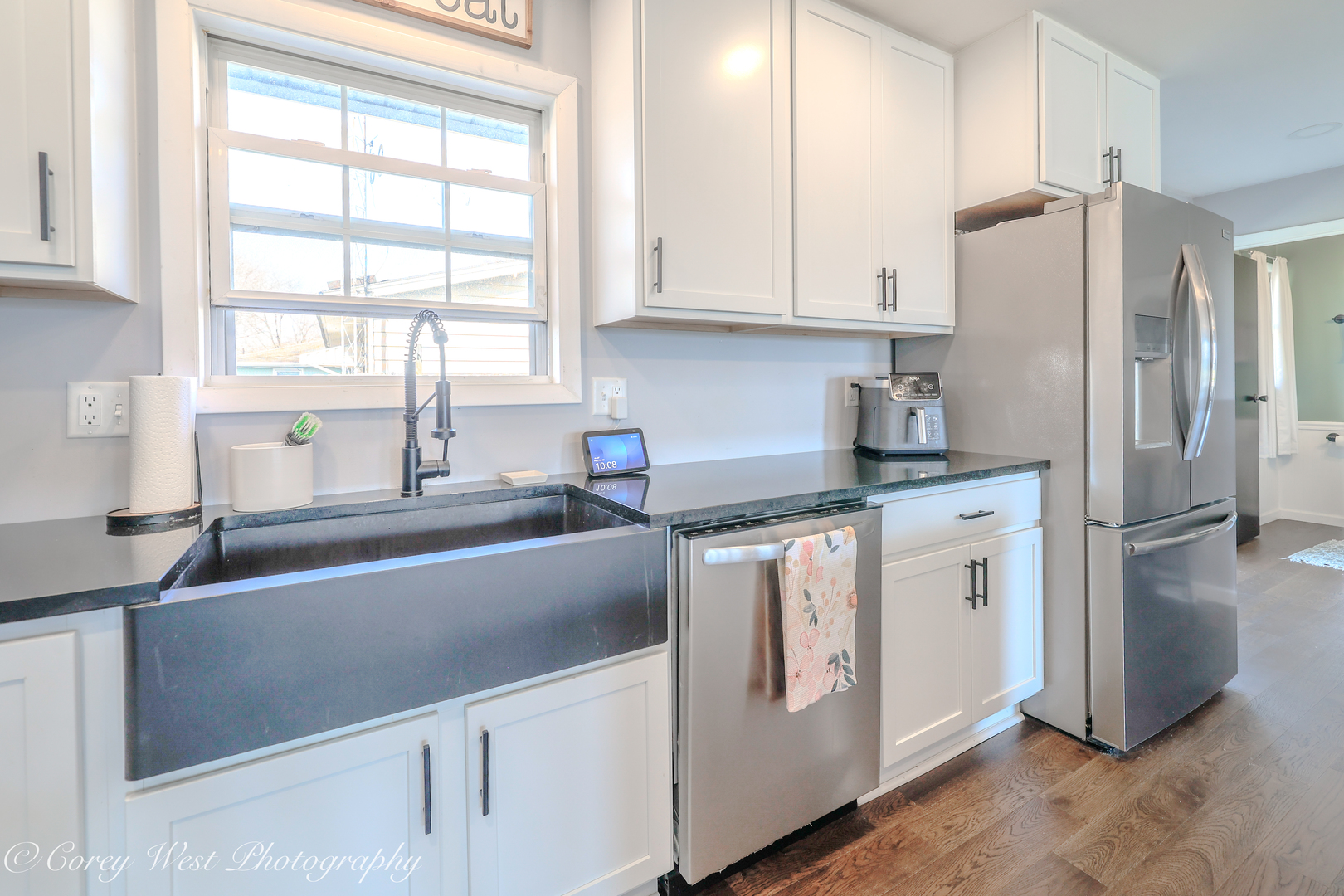 1811 South 7th Street DeKalb, IL 60115 - Photo 10 of 36 a kitchen with stainless steel appliances granite countertop a refrigerator sink and white cabinets