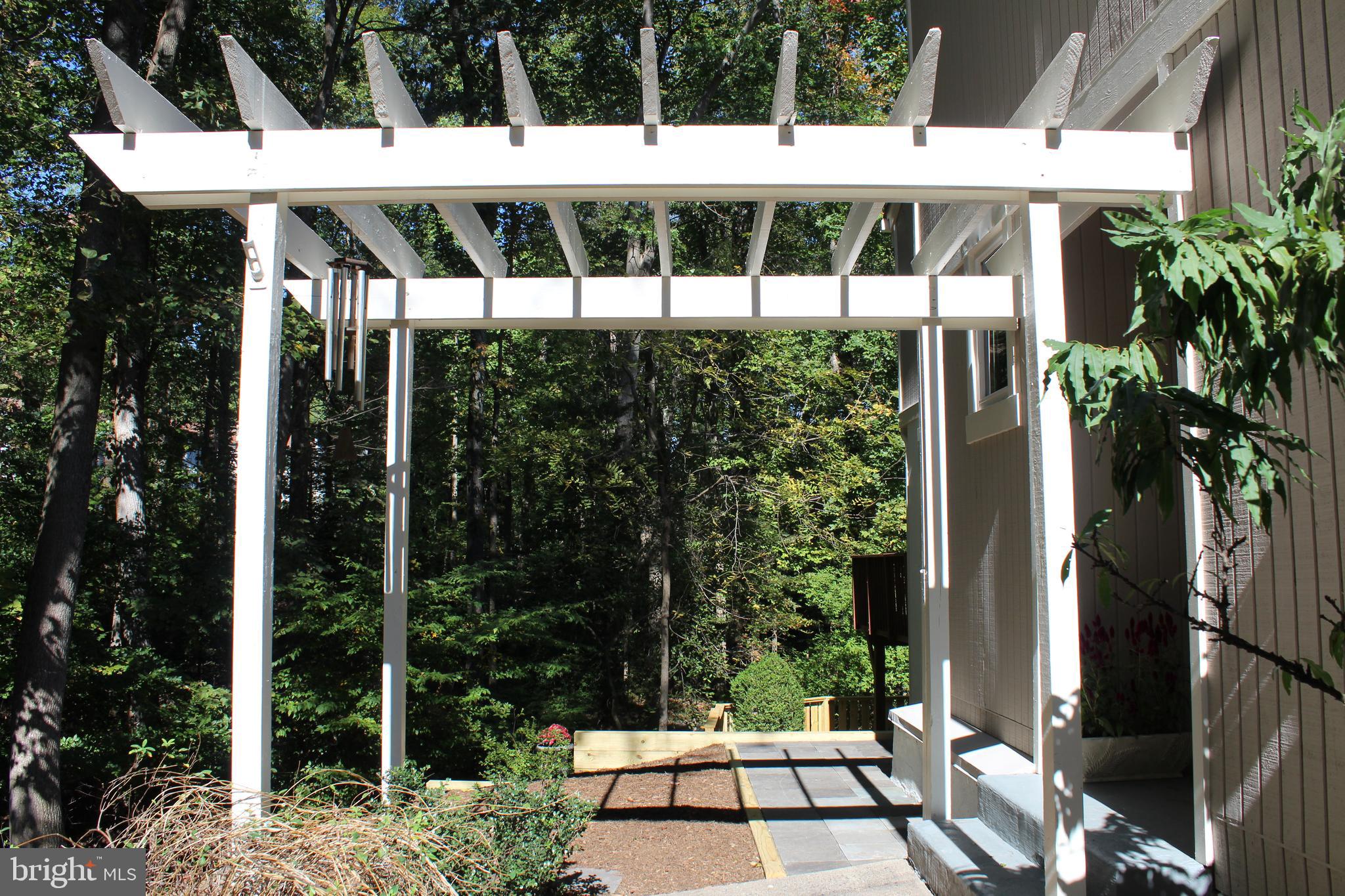 2346 Generation Drive Reston, VA 20191 - Photo 2 of 54 Handsome entry painted wooden pergola