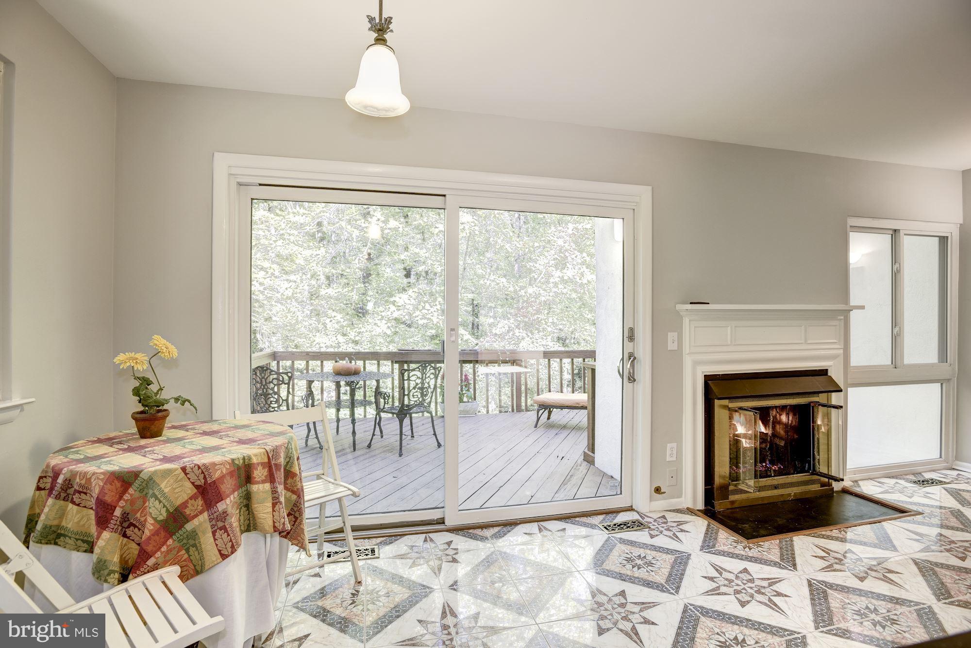 2346 Generation Drive Reston, VA 20191 - Photo 12 of 54 Sliding glass door out to deck backs to woodland