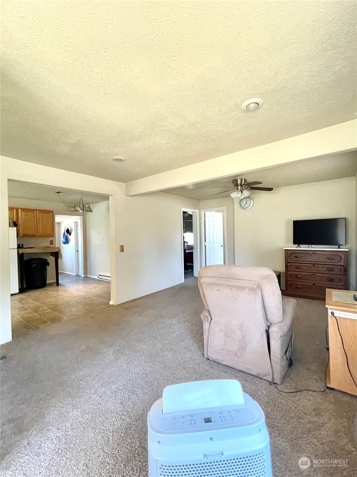 47 Kermel Road Omak, WA 98841 - Photo 11 of 40 a bedroom with a bed and a couch