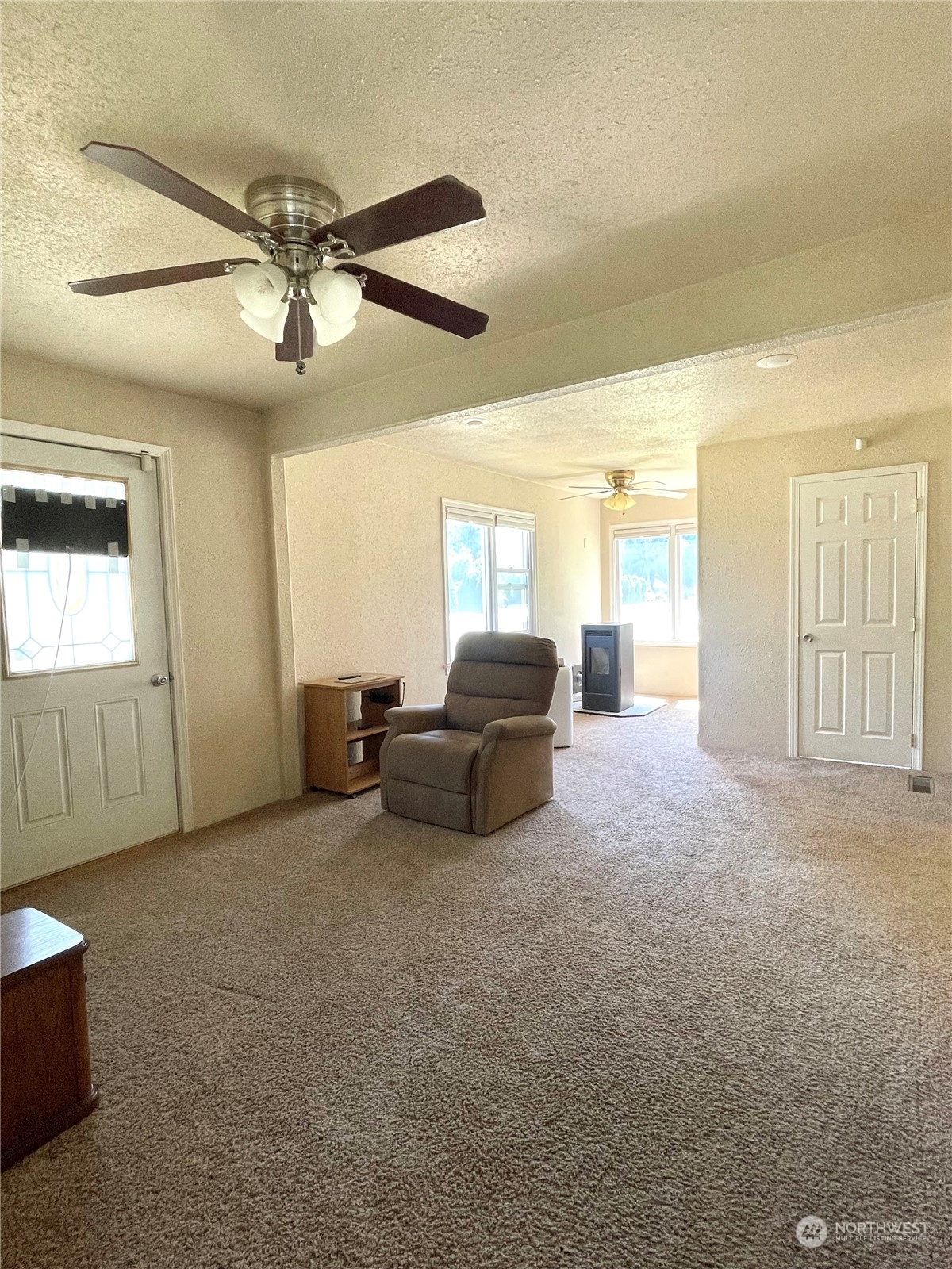 47 Kermel Road Omak, WA 98841 - Photo 12 of 40 a living room with furniture and a ceiling fan