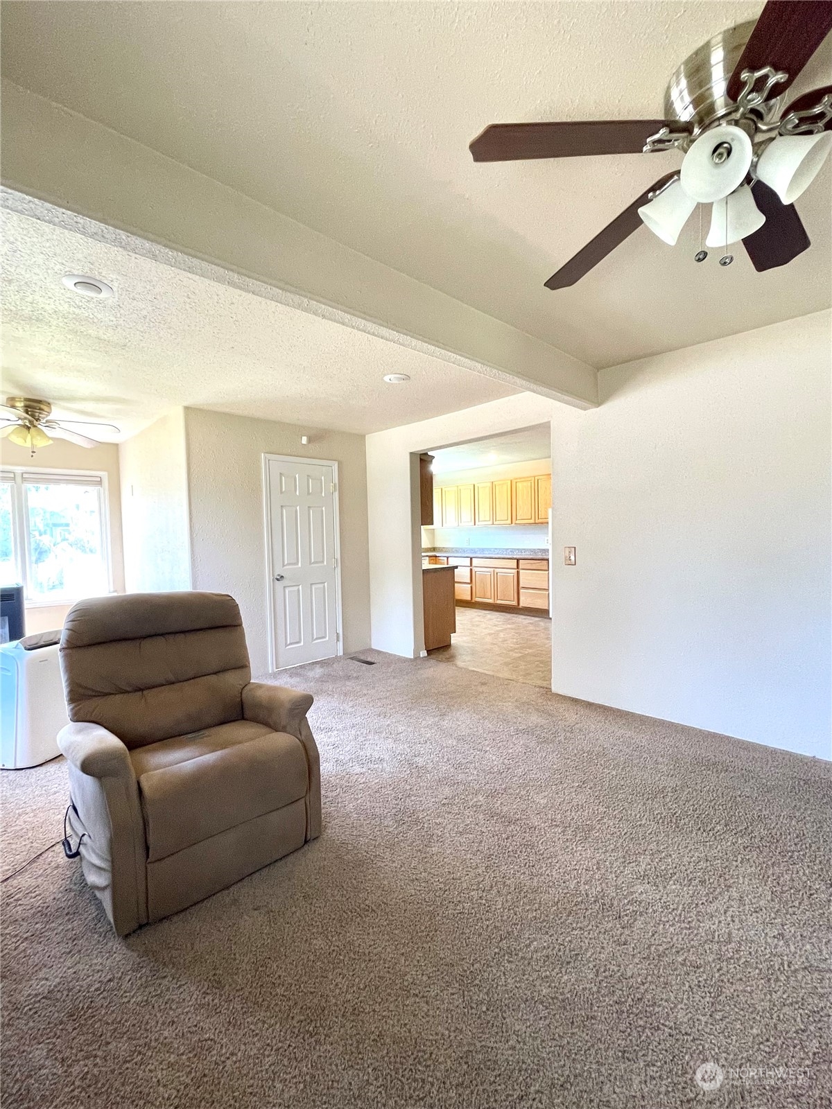 47 Kermel Road Omak, WA 98841 - Photo 14 of 40 a living room with furniture and a large window
