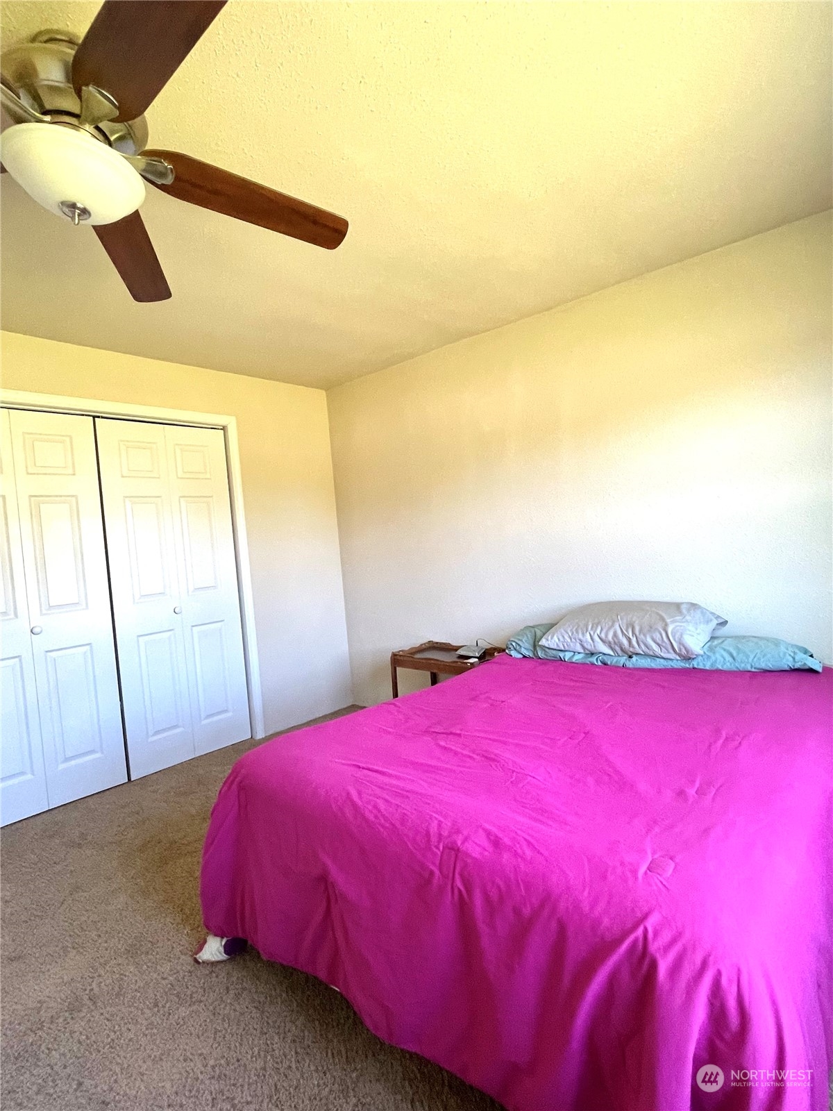 47 Kermel Road Omak, WA 98841 - Photo 16 of 40 a bedroom with a bed and a large window