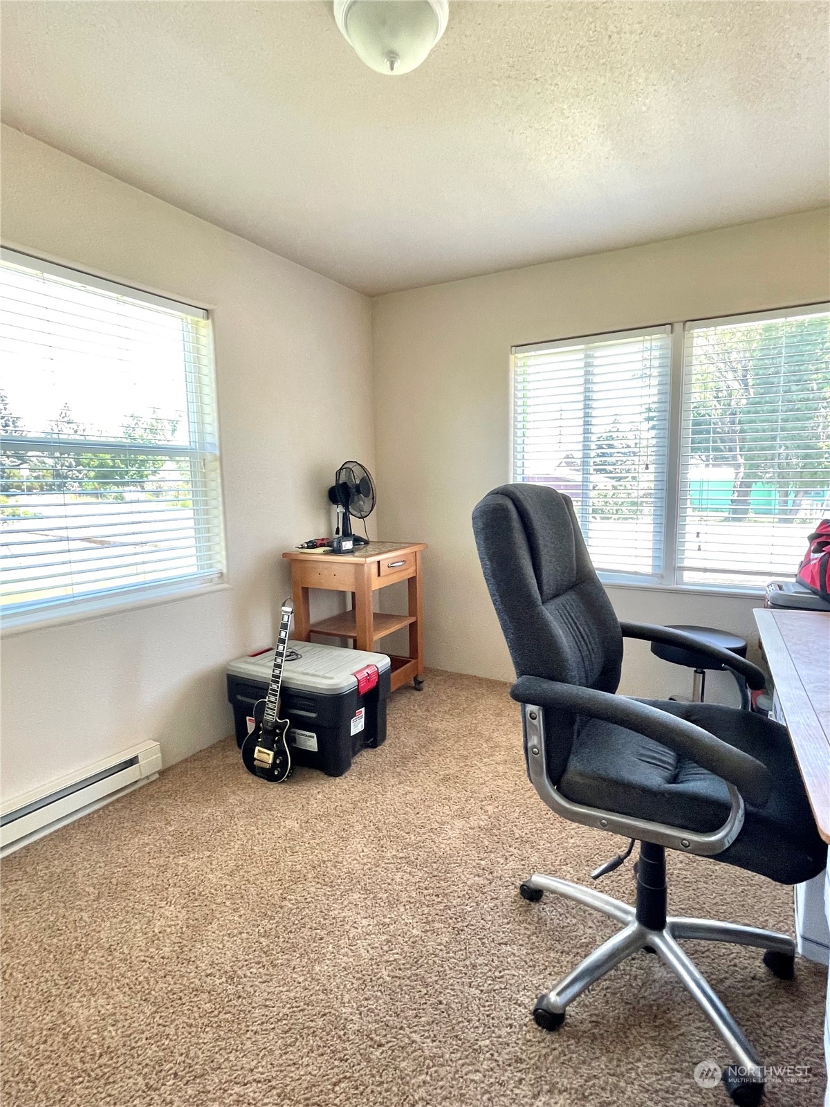 47 Kermel Road Omak, WA 98841 - Photo 18 of 40 a living room with furniture and a window