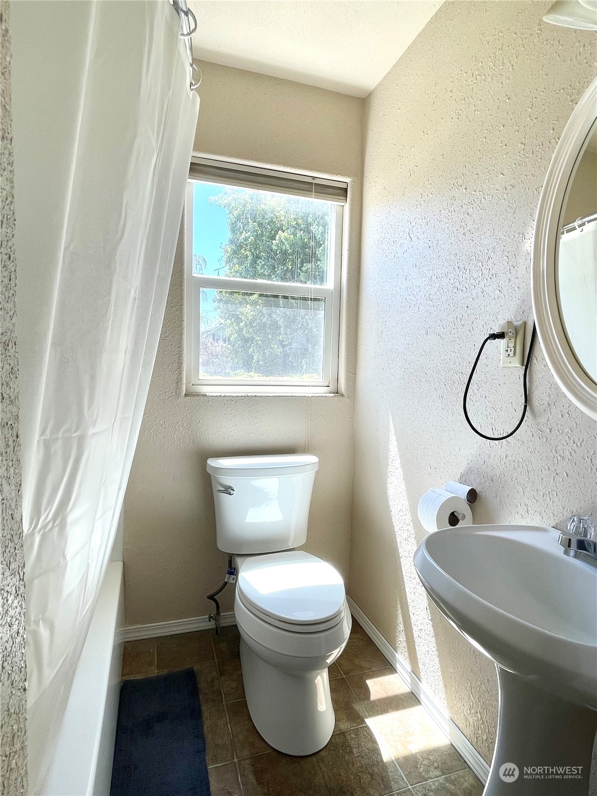 47 Kermel Road Omak, WA 98841 - Photo 19 of 40 a bathroom with a toilet sink and mirror