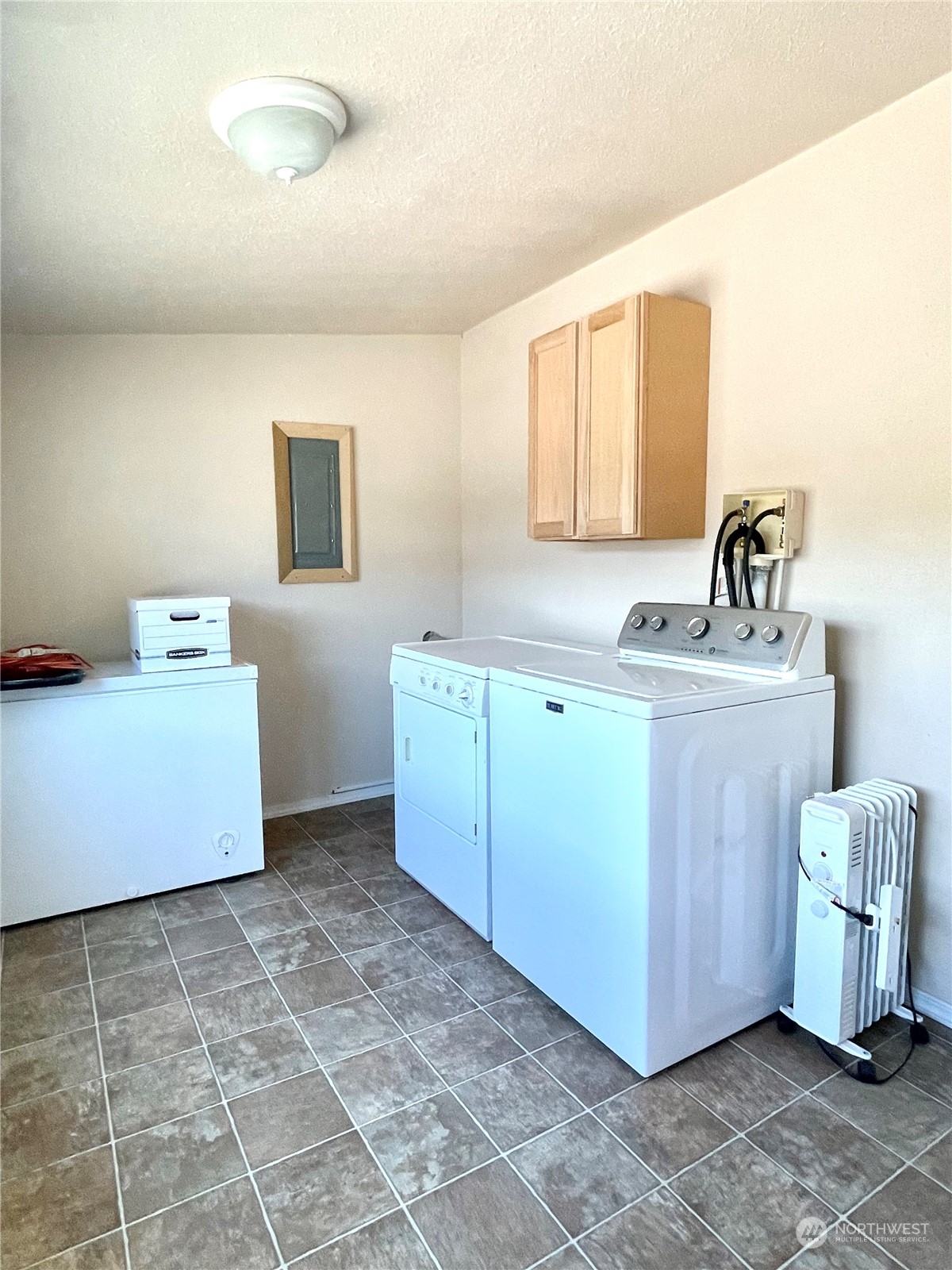 47 Kermel Road Omak, WA 98841 - Photo 20 of 40 a kitchen with a sink cabinets and window