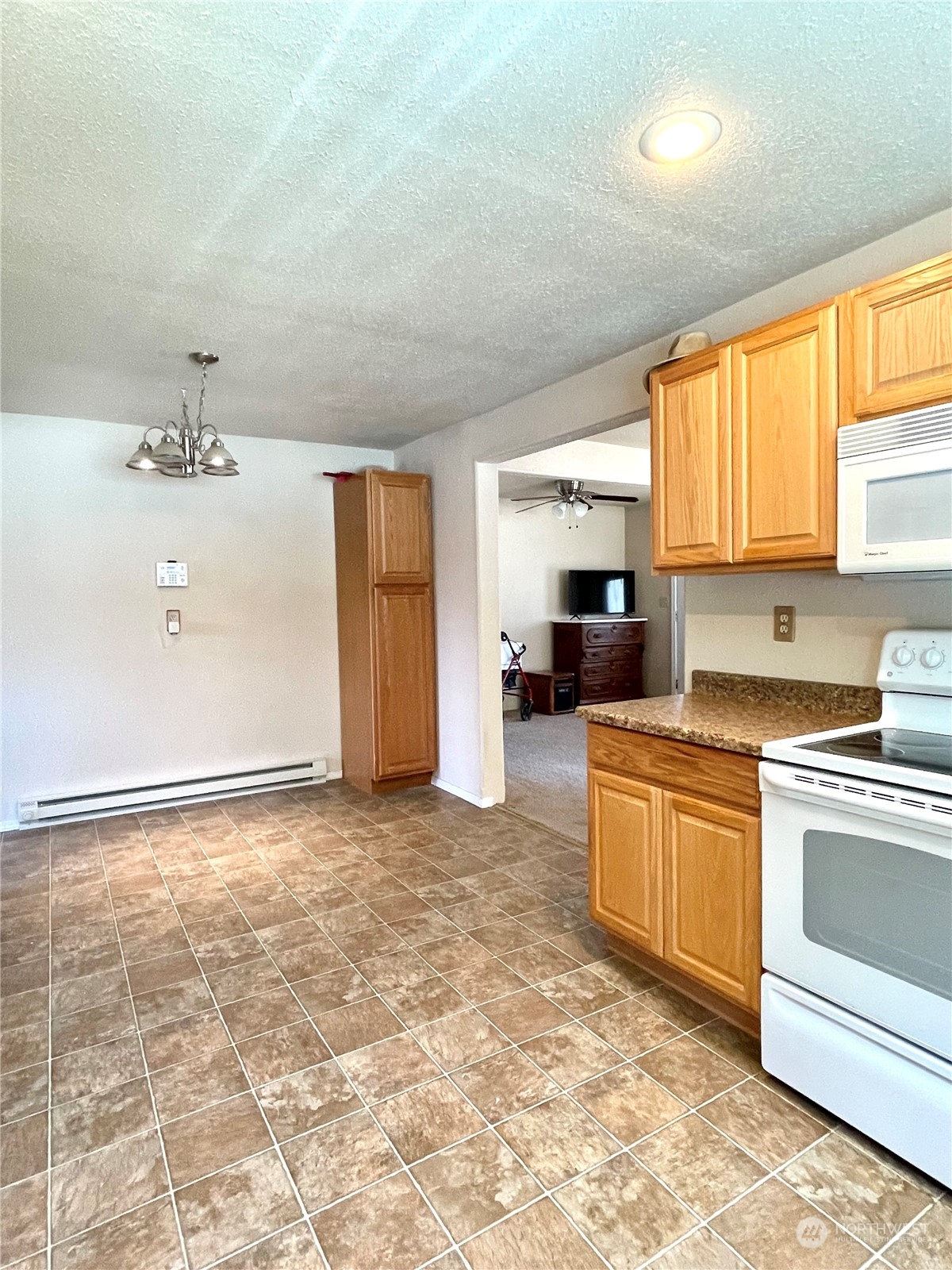 47 Kermel Road Omak, WA 98841 - Photo 8 of 40 a kitchen with stainless steel appliances granite countertop a stove a sink and a refrigerator