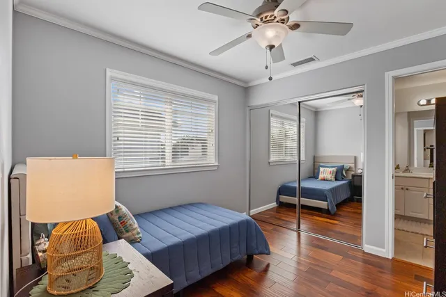 a bedroom with furniture and a window