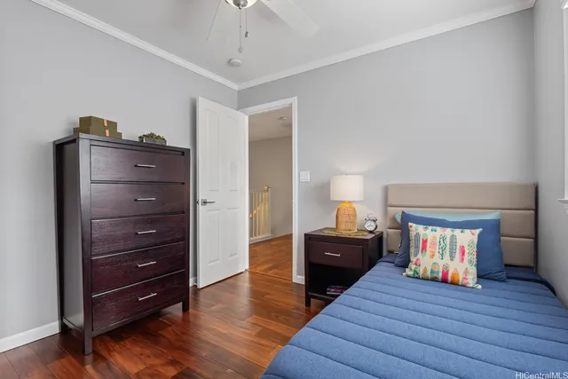 a living room with furniture and a dresser