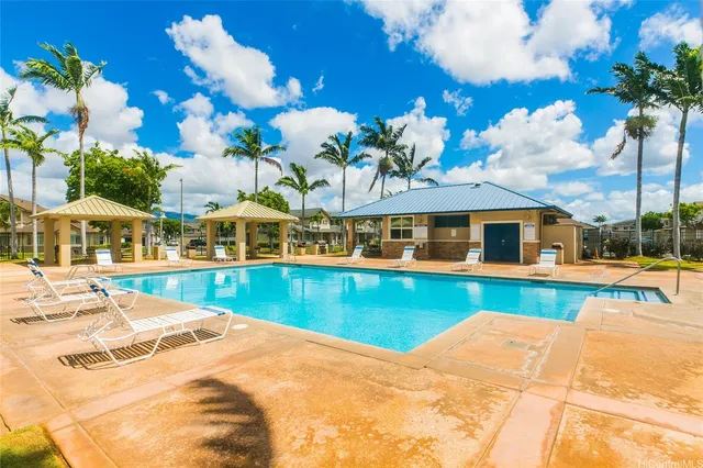 a view of swimming pool with outdoor seating