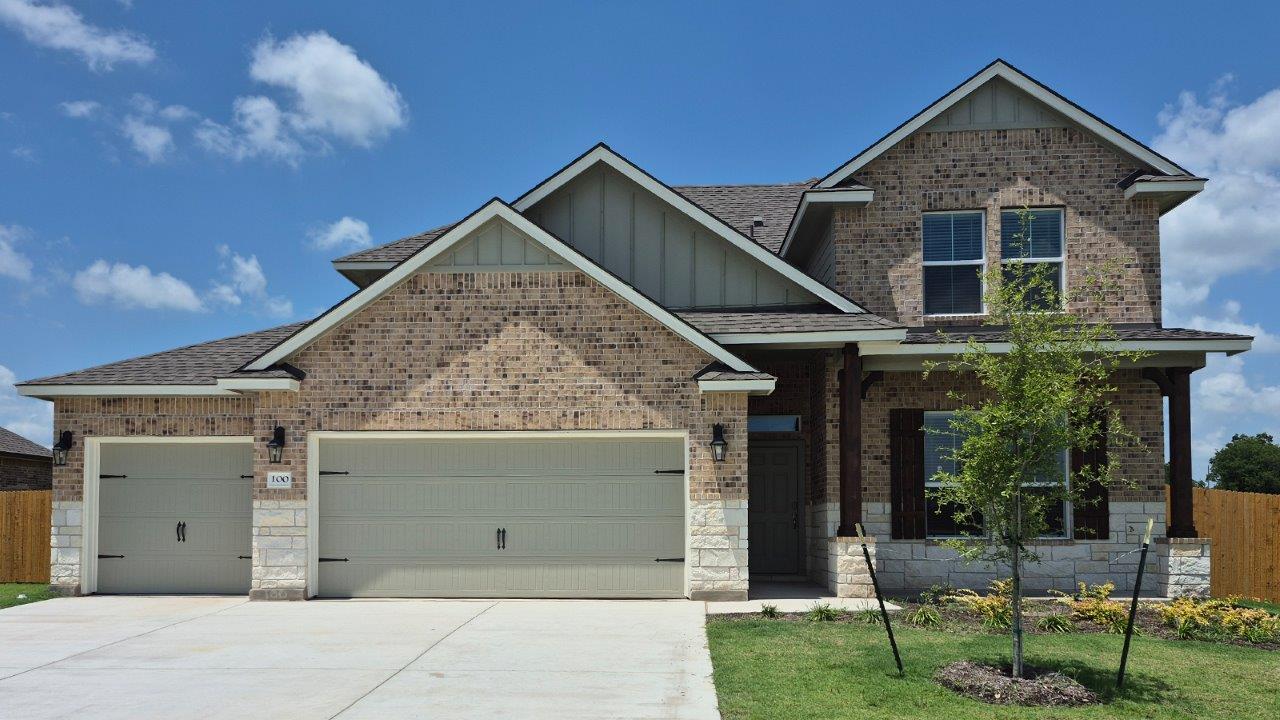100 Jana Way Thorndale, TX 76577 - Photo 1 of 1 a front view of a house with garden