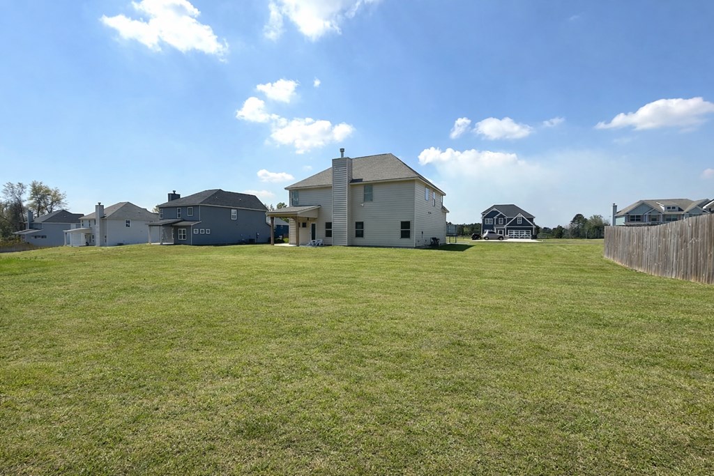 33 Sugar Maple Drive Fort Mitchell, AL 36856 - Photo 29 of 29 a view of a house with a yard and a large tree