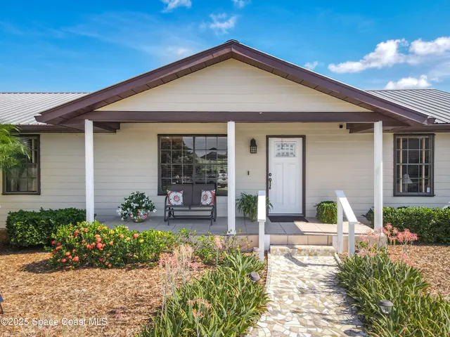 a large kitchen with stainless steel appliances granite countertop a refrigerator and a sink