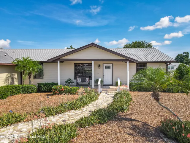 a large kitchen with stainless steel appliances granite countertop a stove sink and cabinets