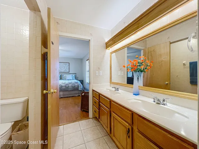 an aerial view of a house with a lake view