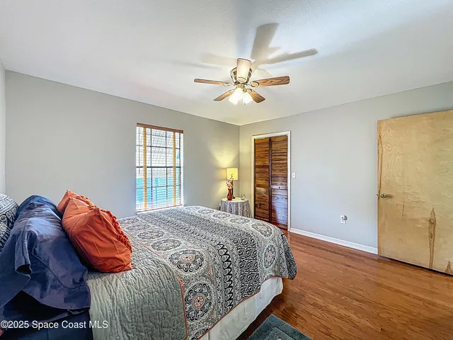an aerial view of residential houses with outdoor space and ocean view
