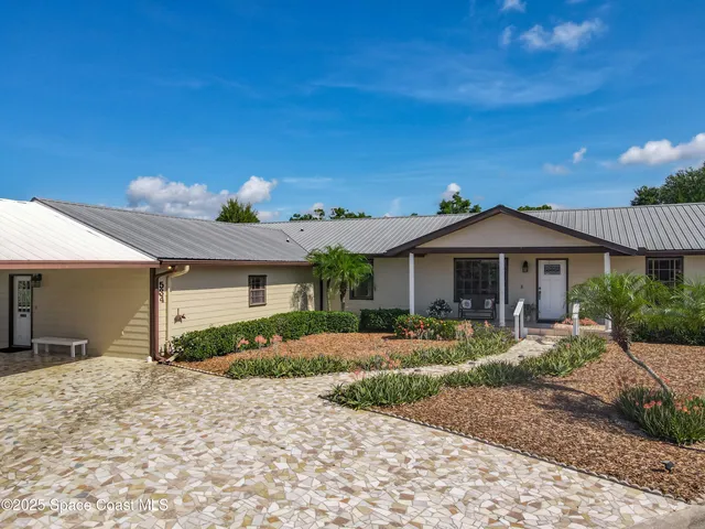 a view of an empty room with closet