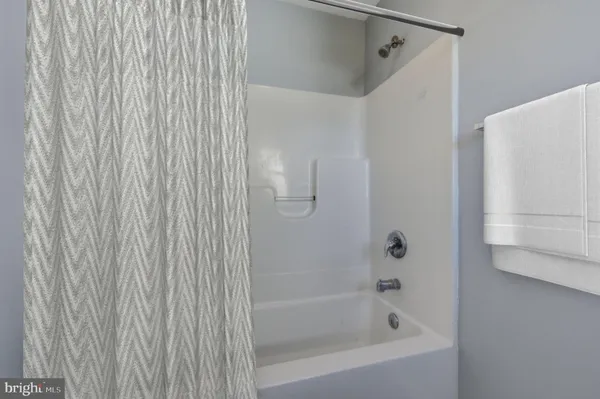 a close up of a bathtub curtain