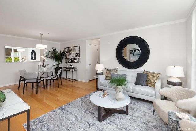 a living room with furniture and a table