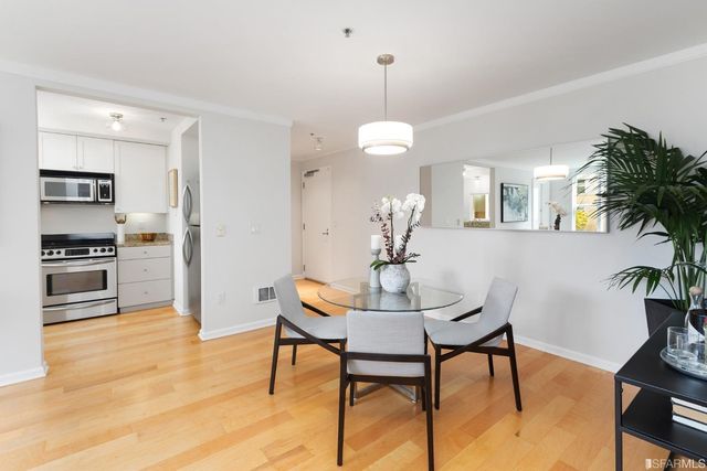 a view of a dining room with furniture and wooden floor