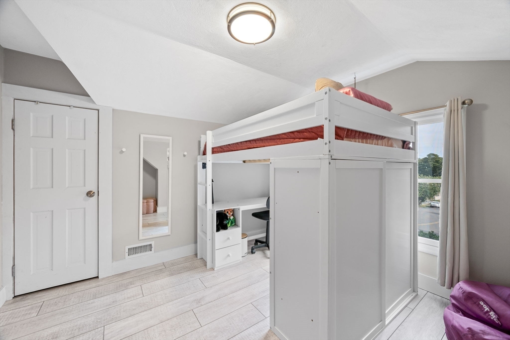 44 Peach Highlands Marblehead, MA 01945 - Photo 27 of 41 a view of a livingroom with wooden floor and cabinet